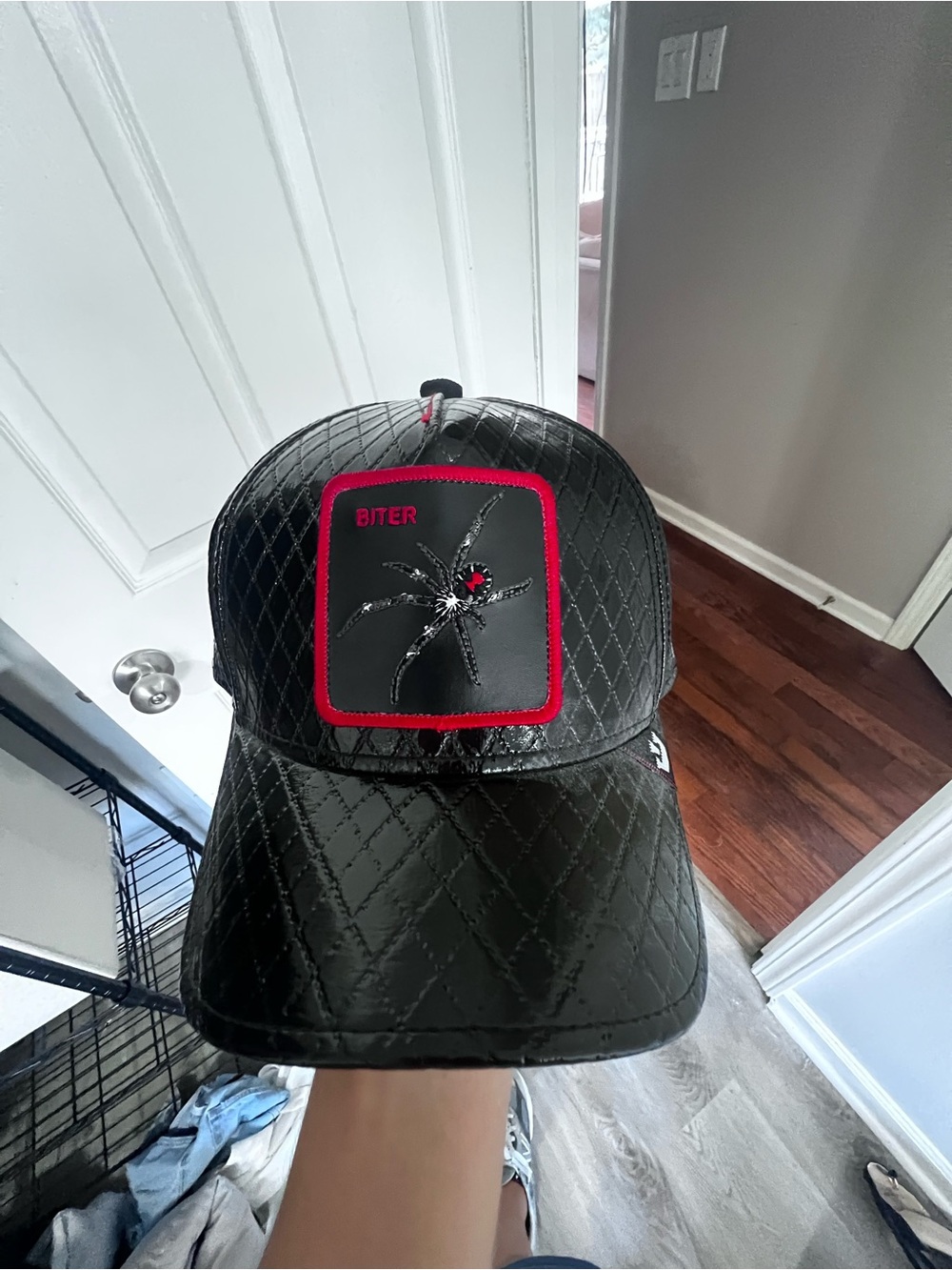 Goorin Bros Biter Black Quilted Leather Snapback Cap with Red-Trim Spider Patch
